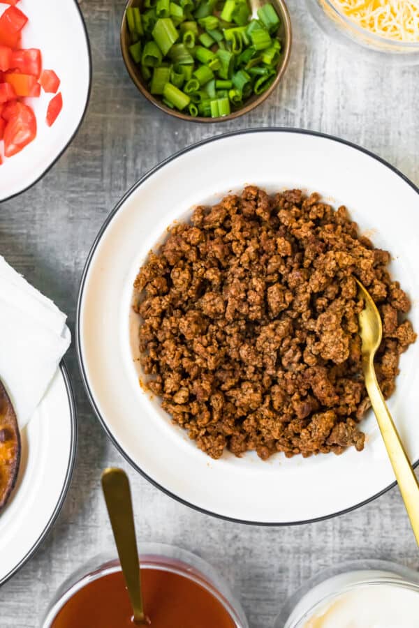 cooked ground beef in white bowl