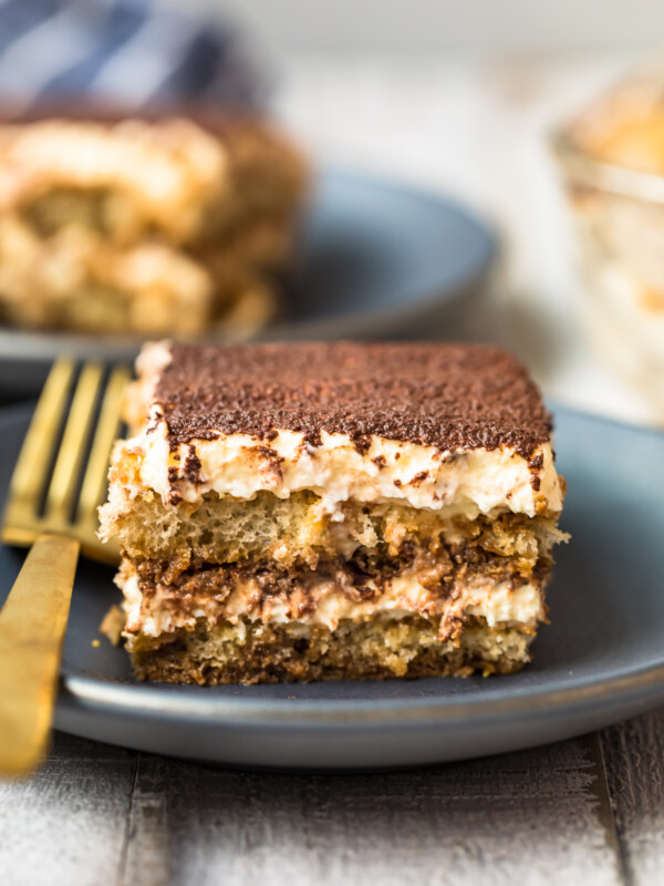 slice of tiramisu on black plate