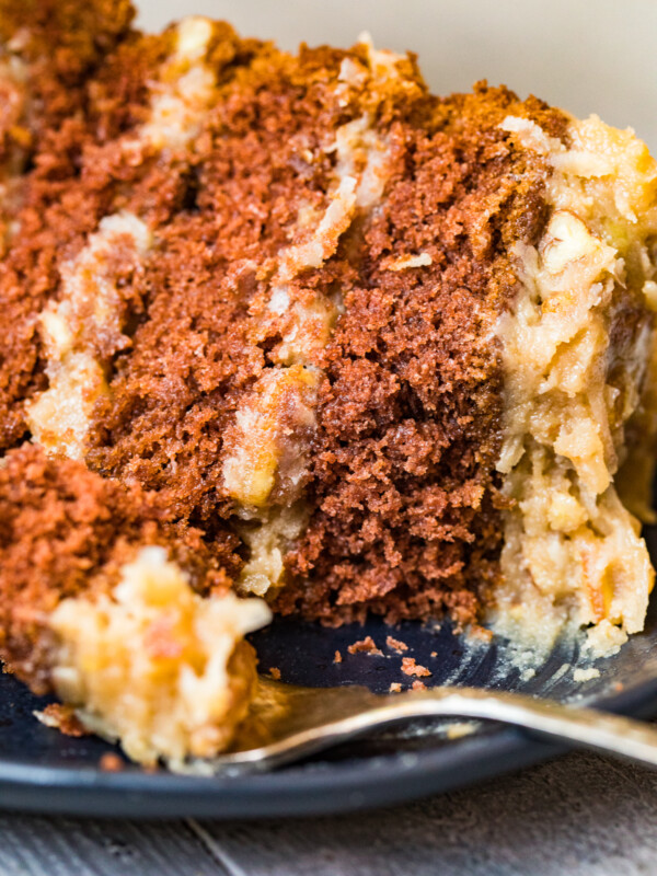 slice of german chocolate cake on black plate