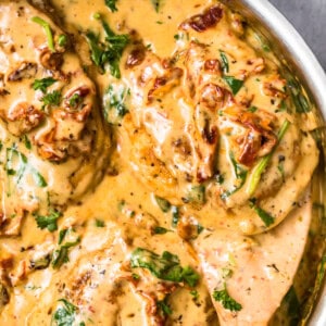 up close image of tuscan chicken in parmesan cream sauce