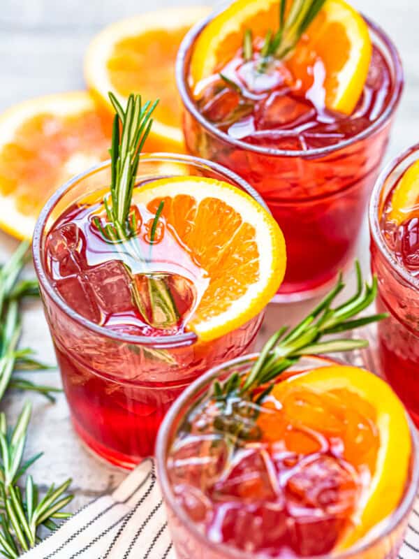 orange cranberry bourbon smash cocktails in glasses