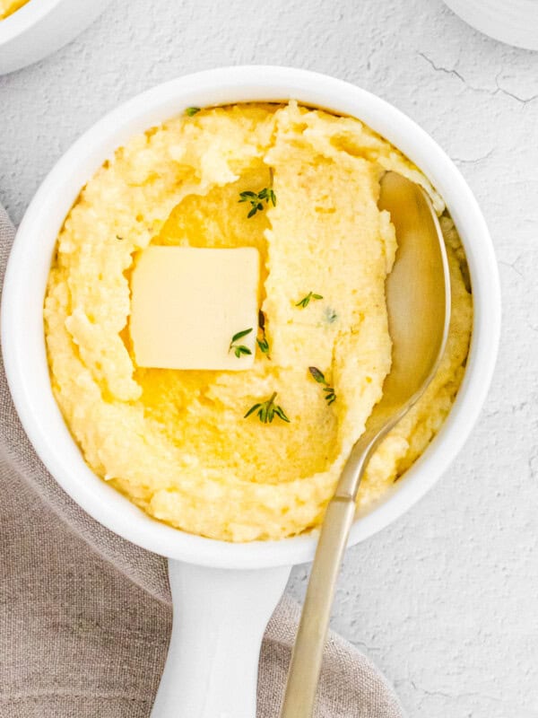 spoon digging into parmesan poletna