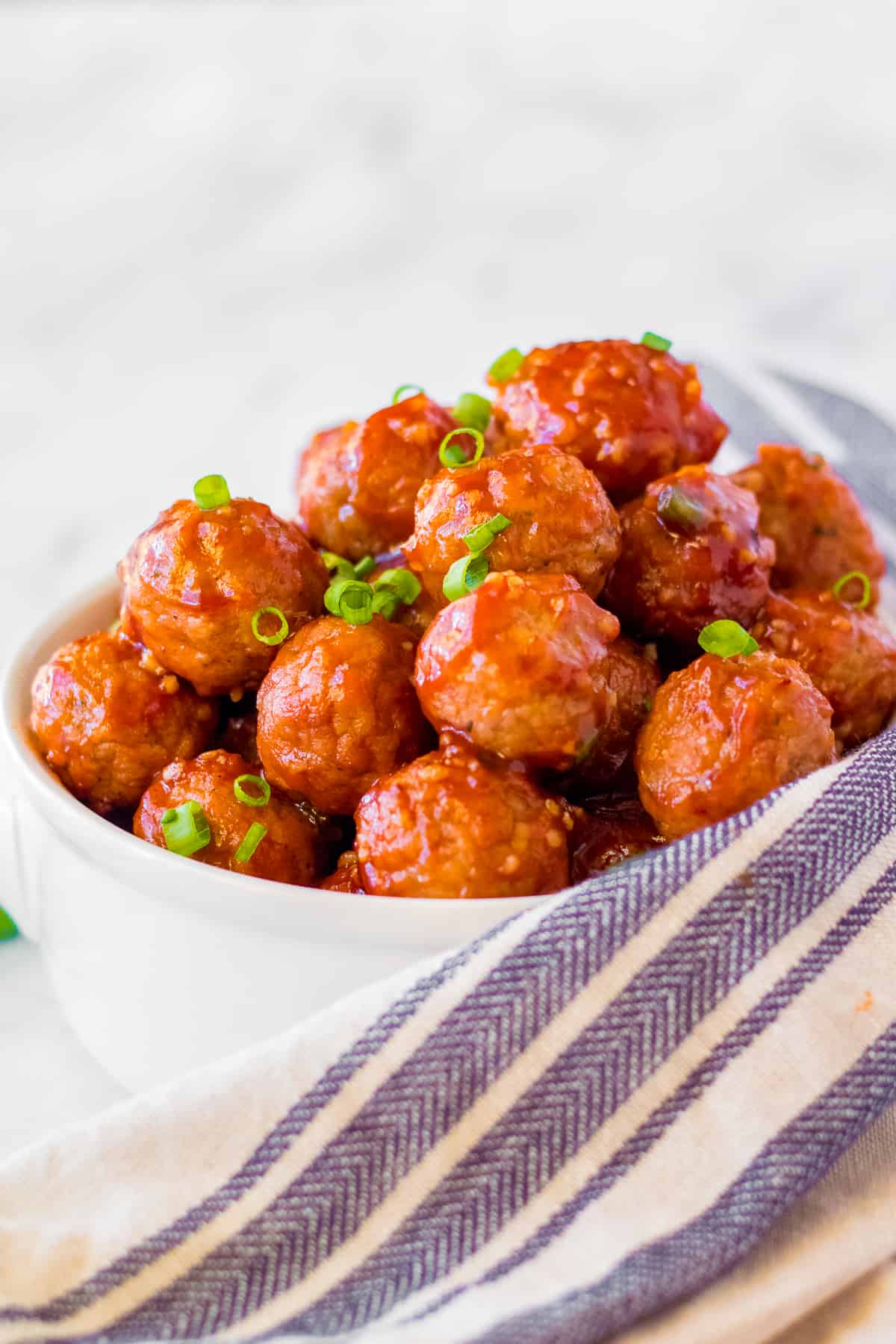 white bowl of honey garlic meatballs