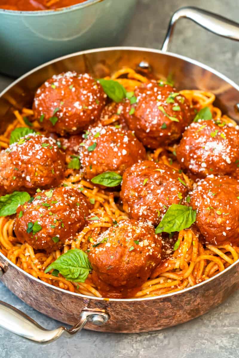 meatballs over pasta in pan