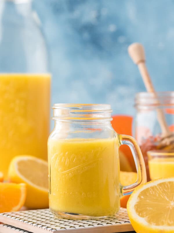 orange ginger shot on table