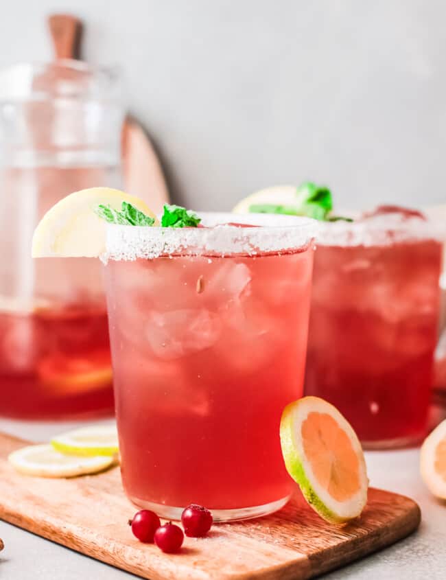 cranberry margaritas in glasses with salt rims