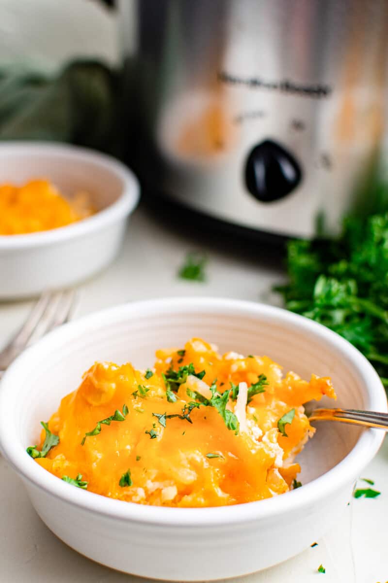 bowl of crockpot cheesy hashbrowns