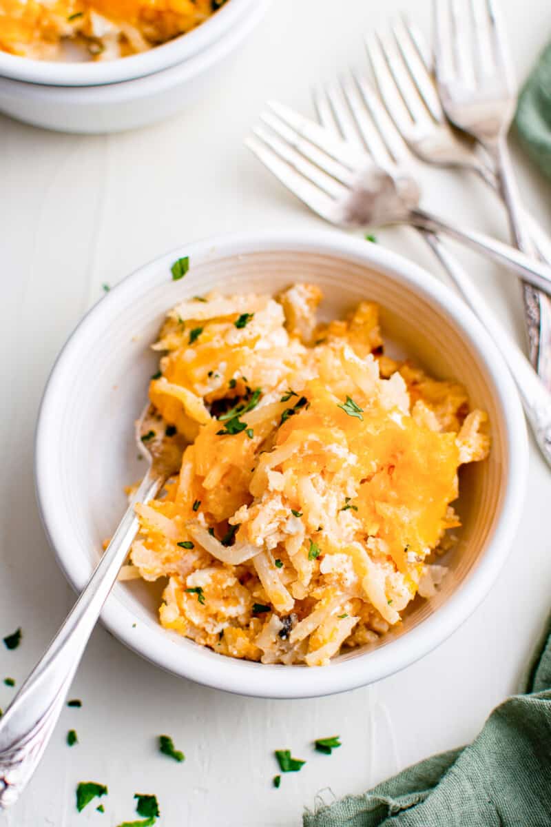 white bowl with cheesy hashbrown casserole