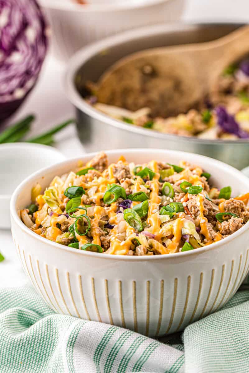 white bowl with egg roll in a bowl