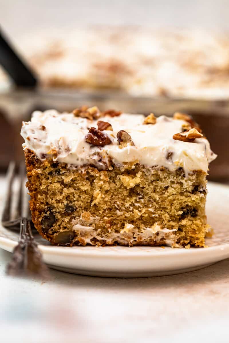 slice of italian cream cake with Cream Cheese Pecan Frosting