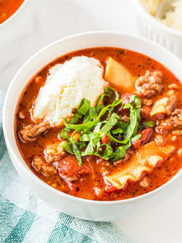 lasagna soup garnished with ricotta and basil