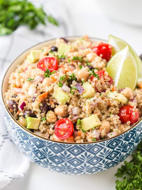 blue bowl filled with quinoa salad