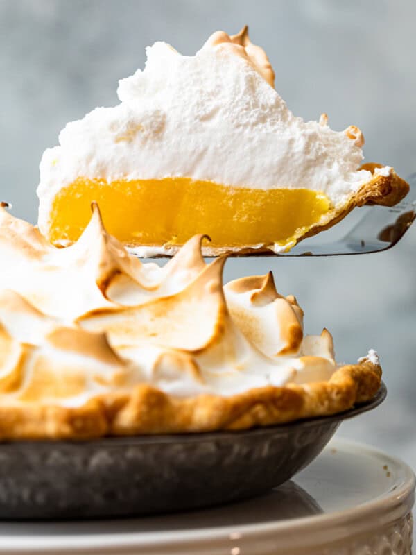 lifting up slice of lemon meringue pie