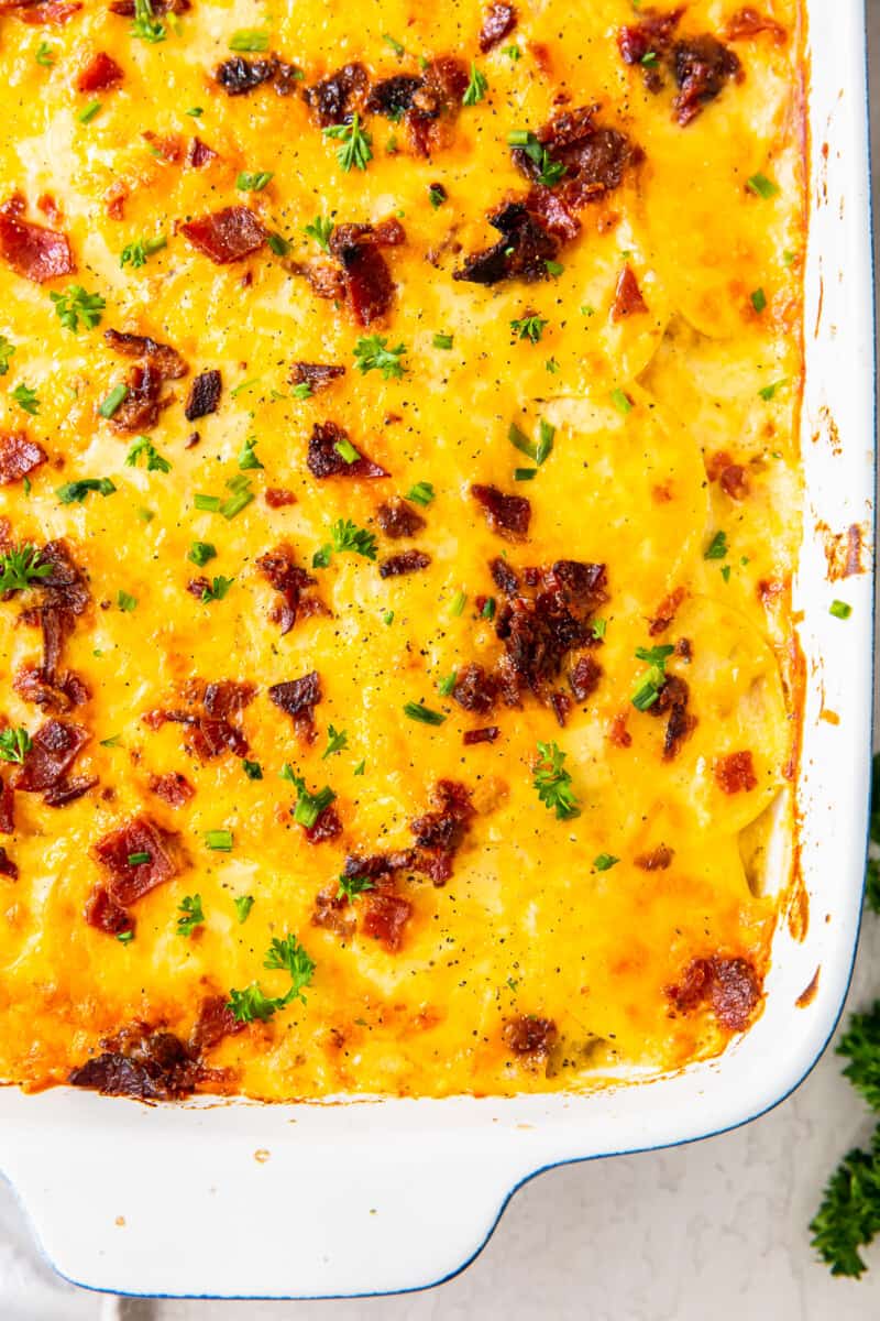 loaded scalloped potatoes in baking dish