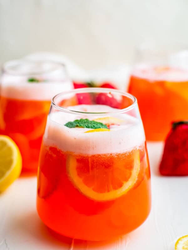 strawberry lemonade in glasses garnished with mint