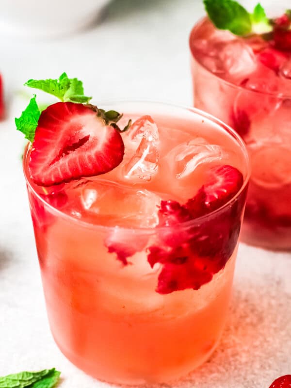 two glasses filled with strawberry palomas