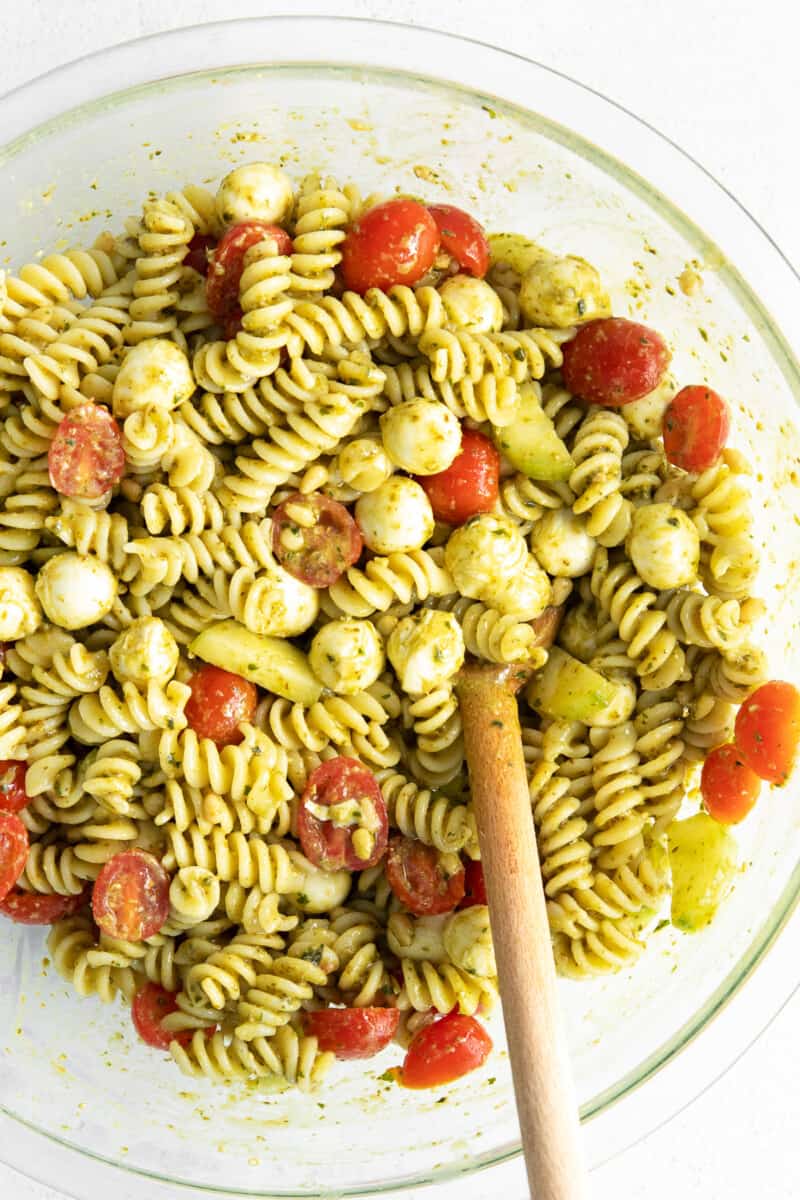 large mixing bowl with pesto pasta salad