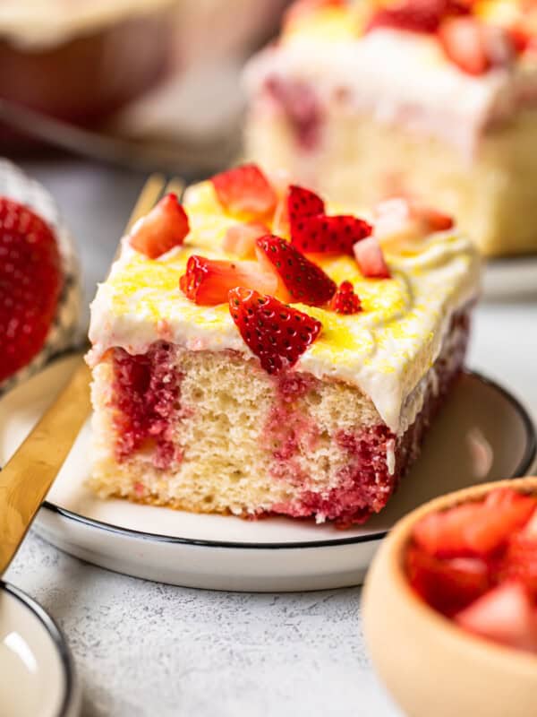 slice of strawberry lemonade poke cake