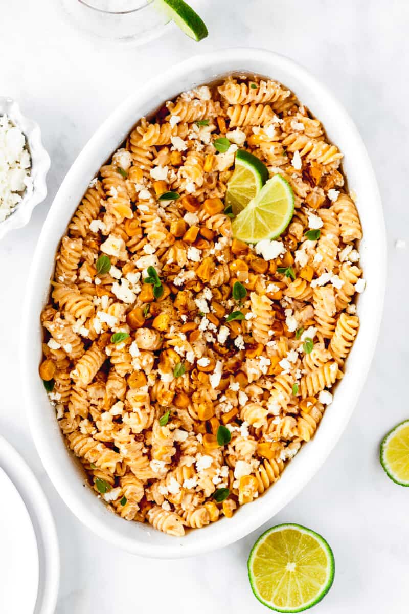 white serving platter with street corn pasta salad