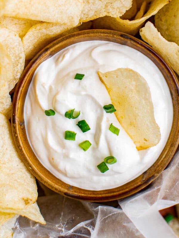 up close chip dip in a bowl garnished with chives