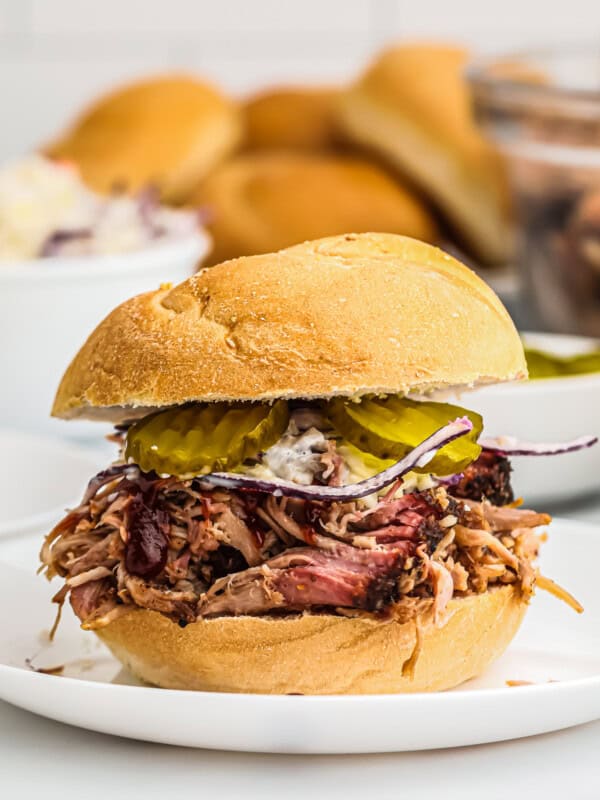 smoked pulled pork sandwich with pickles