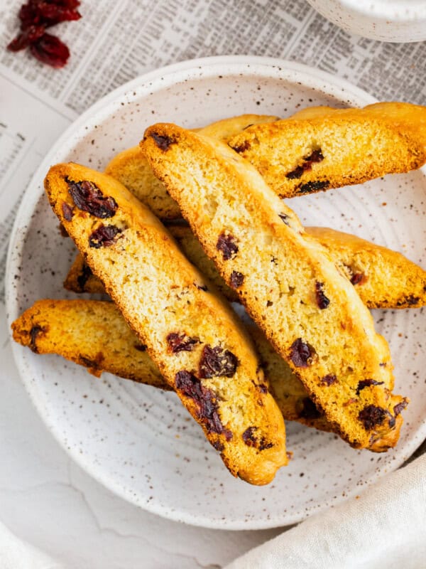 cranberry orange biscotti on gray plate