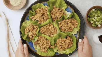 overhead view of ground chicken lettuce wraps on a plate.