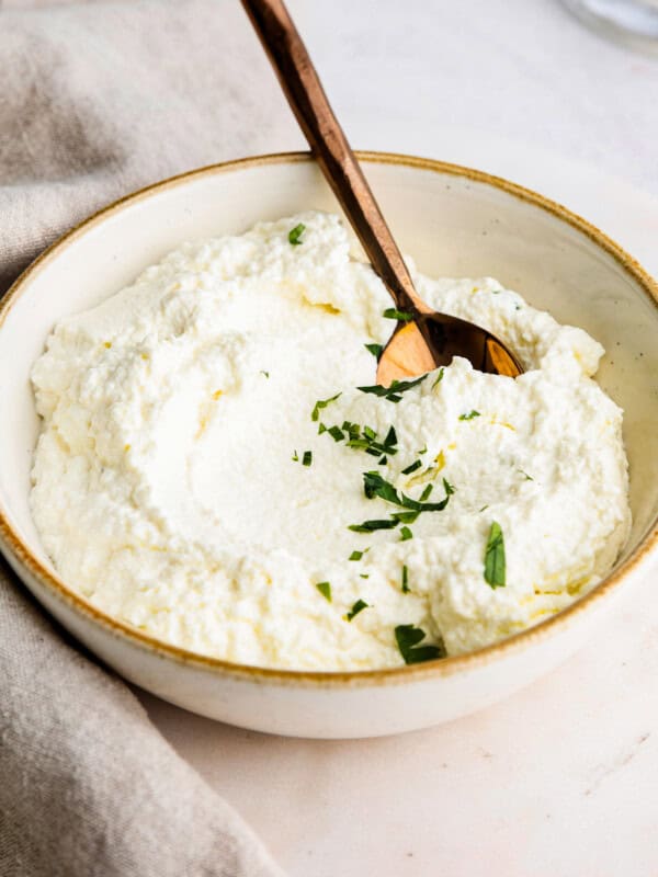 spoon in ricotta in bowl