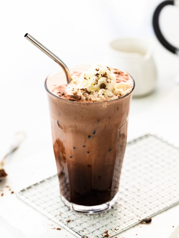 iced mocha in tall glass with whipped cream