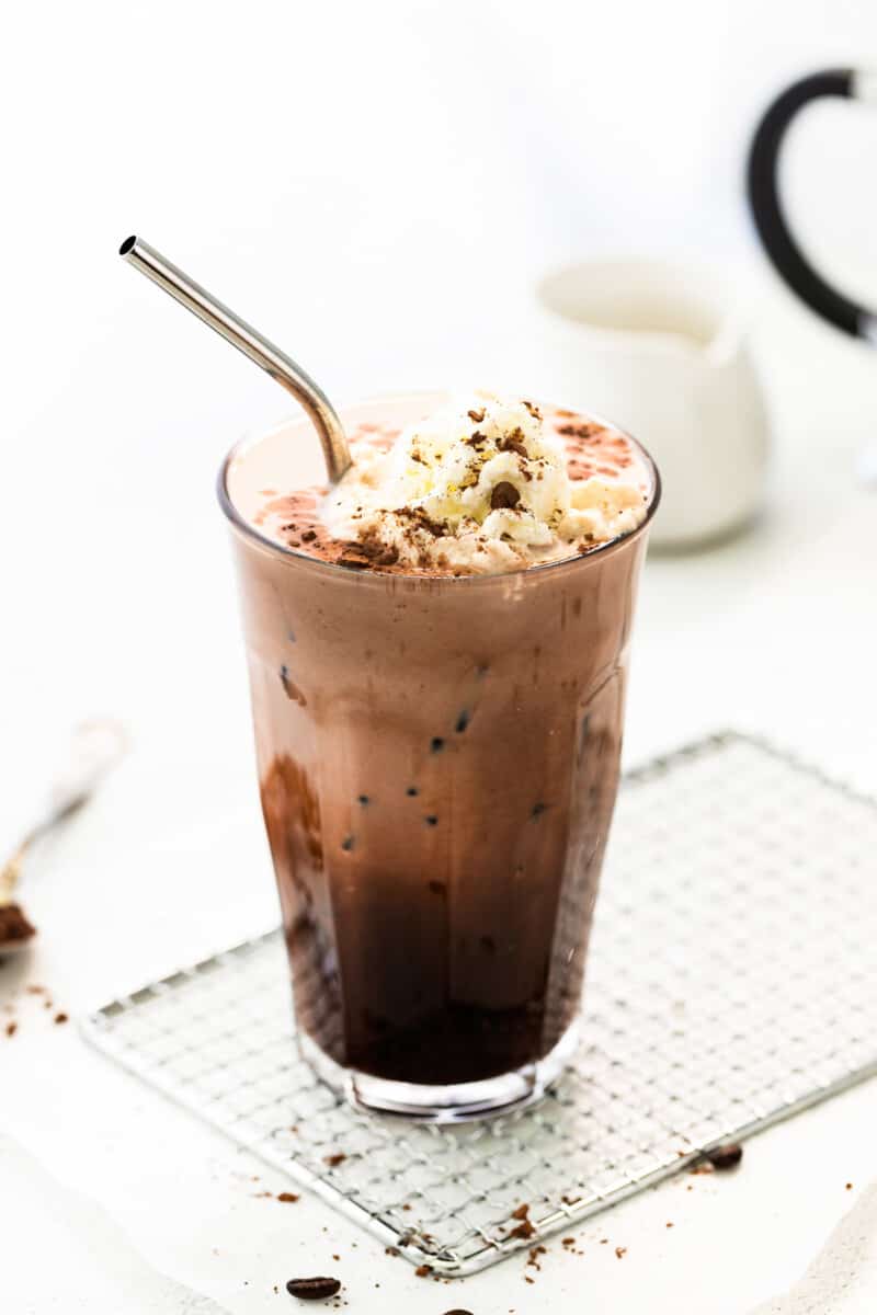 iced mocha in tall glass with whipped cream