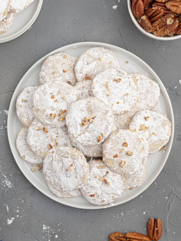 white plate with stacked pecan sandies