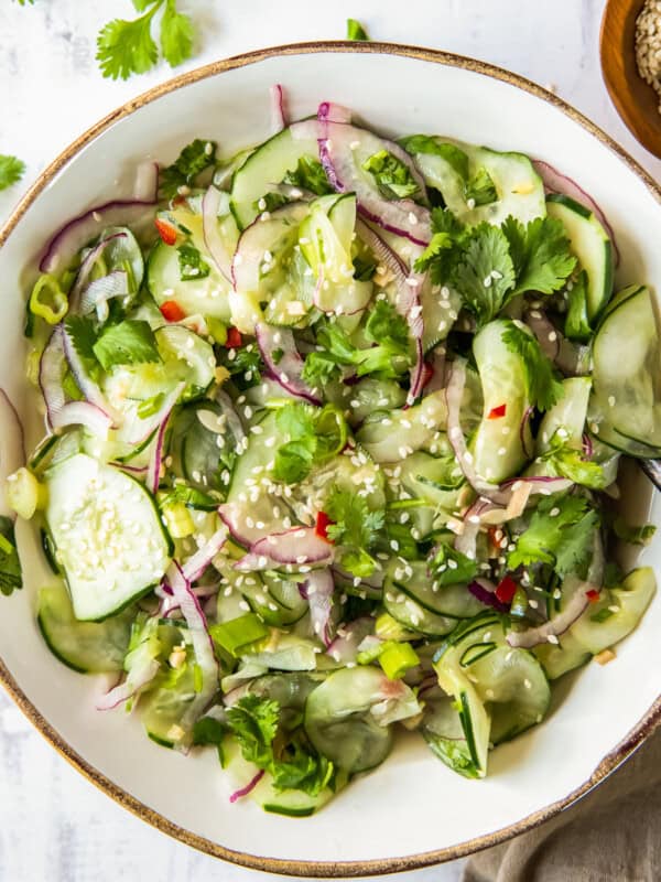 asian cucumber salad in white bowl