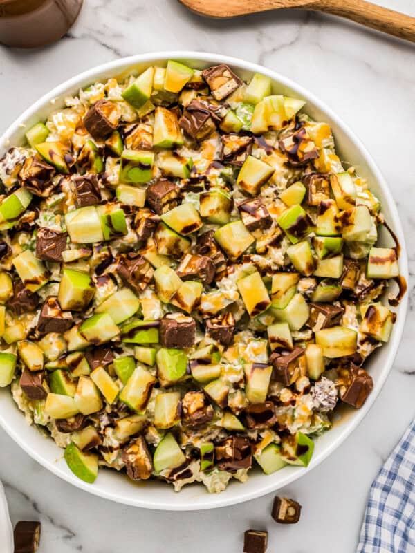 white bowl filled with snickers apple salad