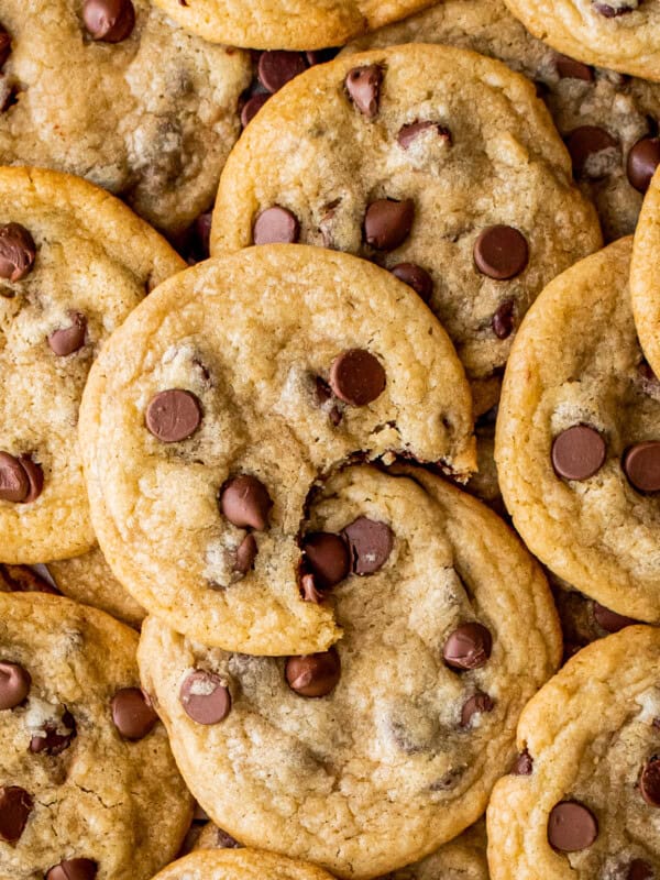 brown butter chocolate chip cookies with a bite taken out of one