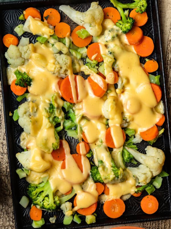 cheesy roasted vegetables on sheet pan