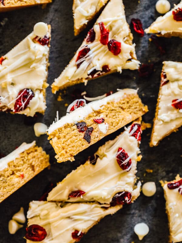 overhead sliced cranberry bliss bars on black platter