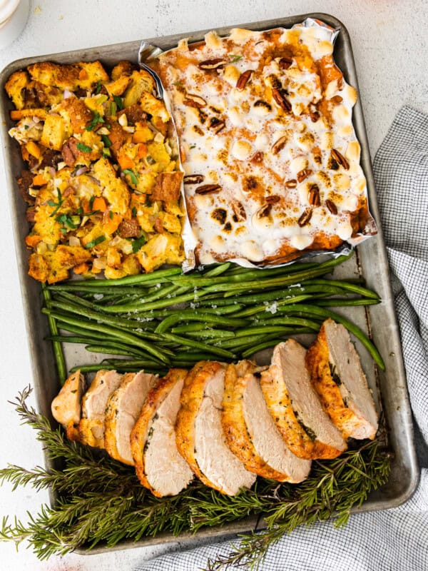 4 parts of sheet pan thanksgiving including sweet potato casserole, dressing, green beans, and turkey breast