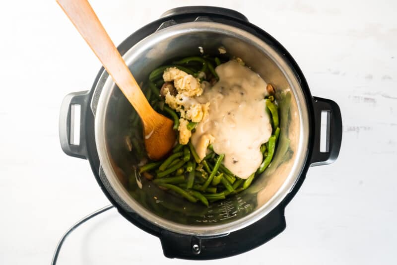 cream of mushroom soup added to green bean casserole filling mixture in instant pot