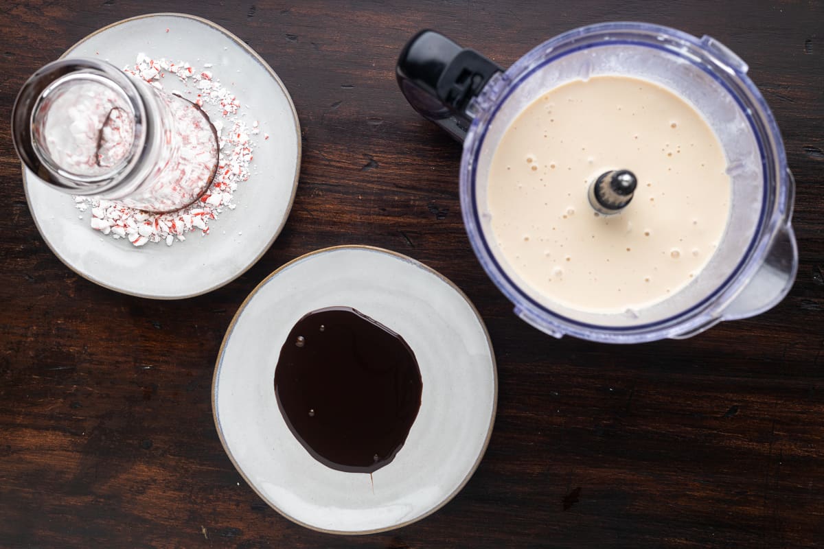 Dipping station set up; one plate with crushed peppermints, one plate with chocolate sauce.