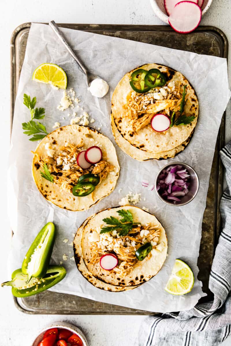 instant pot shredded chicken tacos on baking sheet