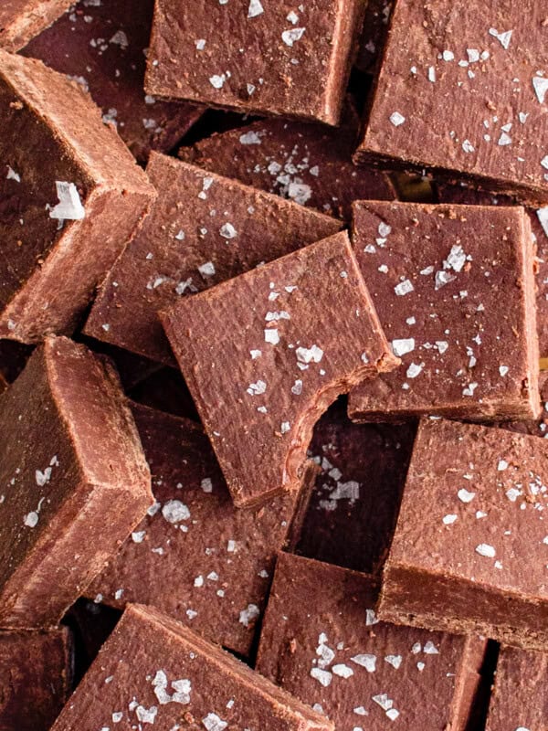 squares of chocolate fudge with a bite taken from one