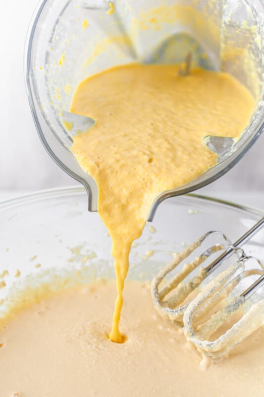 pouring creamed corn mixture into cornbread batter