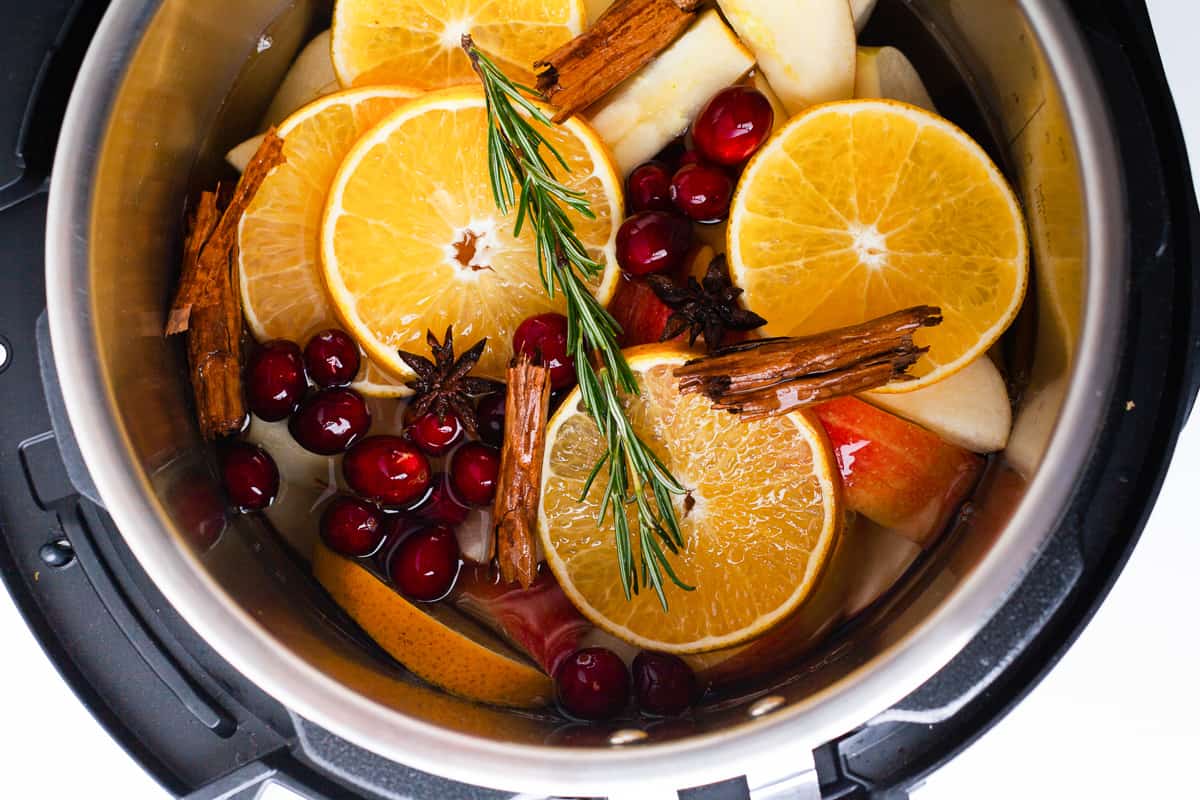 Apple cider ingredients in an Instant Pot.