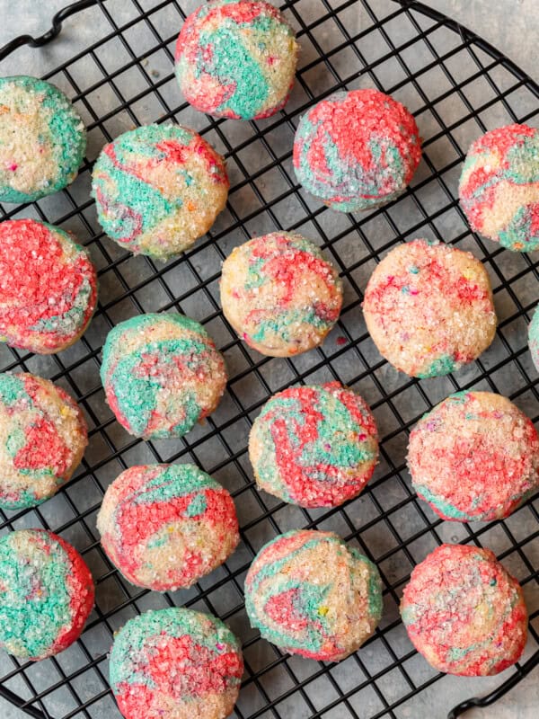 overhead image of tie dye cookies on a round cooling rack