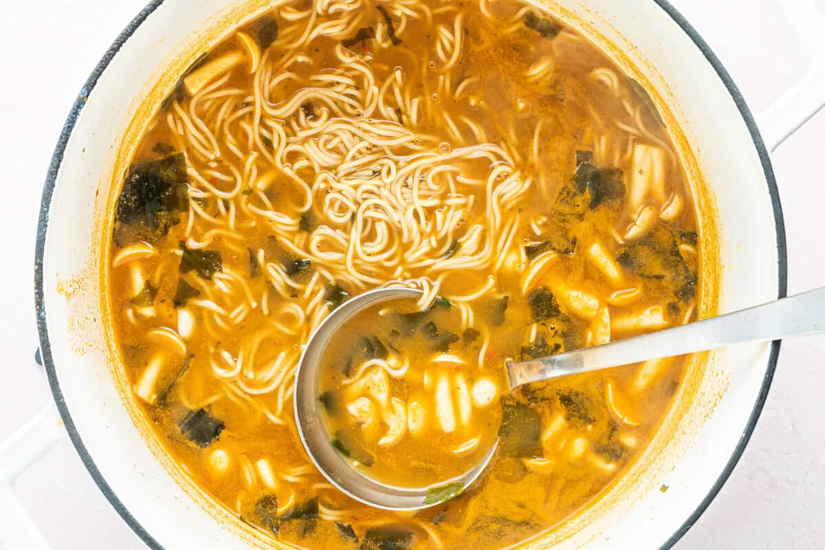 overhead view of easy ramen with a stainless steel ladle.