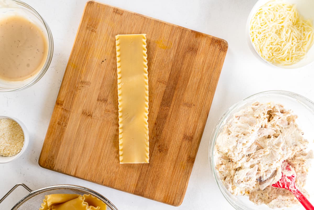 lasagna noodle on a wood cutting board