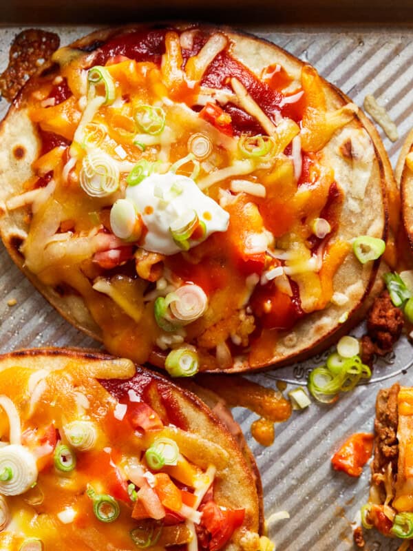 two beef mexican pizzas on baking sheet