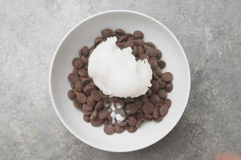 Combine all chocolate, coconut oil and salt in glass bowl.