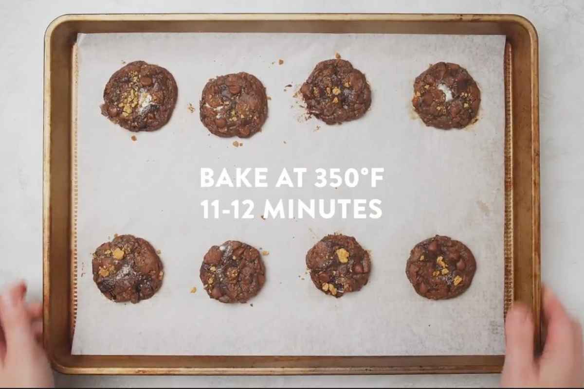 brownie s'mores cookies baked and sitting on baking sheet.