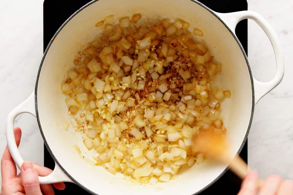 Softened onion and garlic cooked together for 30 sec in a dutch pan.